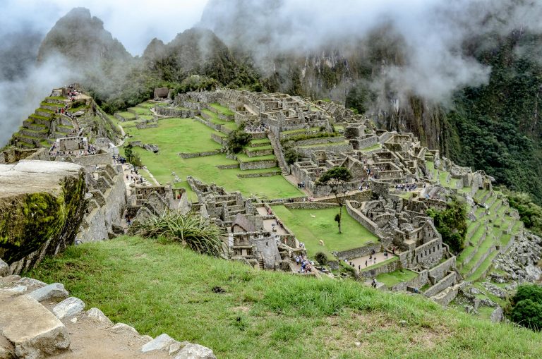 Explore the breathtaking ancient city of Machu Picchu nestled in the Andes mountains of Peru.